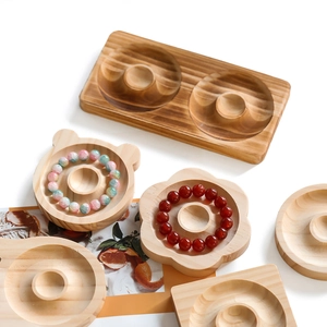 Detailed top view of natural wooden jewelry display trays with bead measuring scales
