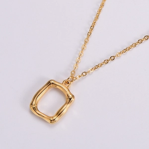 Gold plated stainless steel necklace with a vintage bamboo texture rectangular pendant