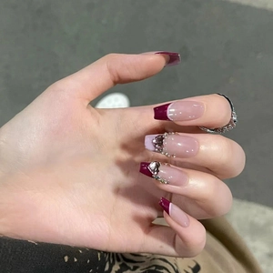 Sparkling burgundy French press-on nails with silver hearts and crystal rhinestones