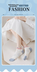 Close-up of breathable cotton socks with star pattern and cute pink ribbed cuffs