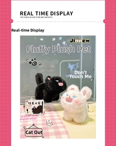 Detail of fluffy kitten plush keychains in black and white with cute embroidered faces