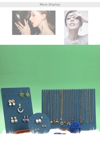 Macro shot of assorted golden necklaces and earrings on blue velvet display boards