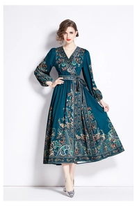 Detailed view of dark cyan paisley print V-neck dress with waist tie and long puff sleeves