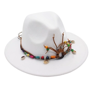 Close-up of white wide brim fedora hat with bohemian beaded band and seashell charms