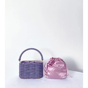 Detail of purple beaded handbag with pink satin drawstring lining and pearl charms