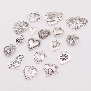 Assorted vintage silver heart charms for DIY jewelry making in various sizes and designs