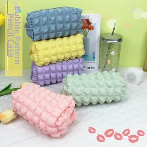 Detailed view of bubble texture on macaron-colored large capacity stationery pouches