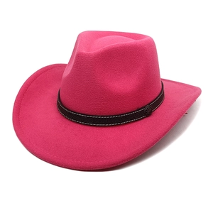 Detail of rose pink wool felt cowboy hat with textured brown band and vintage metal buckle