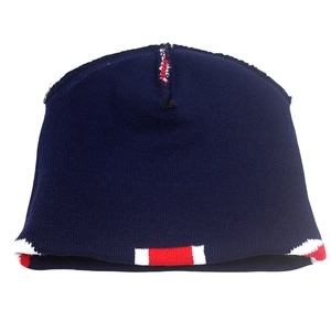 Detailed knit texture of navy blue beanie with red and white stripe patterns