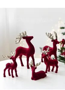Macro detail of wine red flocked reindeer pendant with sparkling glitter antlers decor