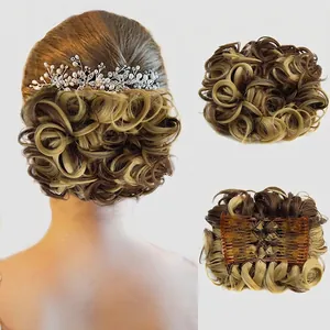 Detail showing the inner hair comb attachment of this brown and blonde messy bun hairpiece