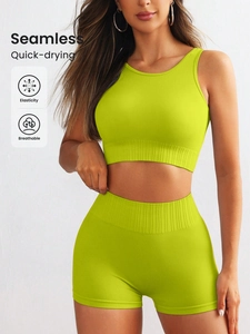Neon yellow seamless ribbed yoga set with crop top and high waist shorts for fitness