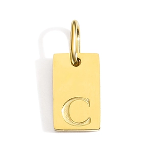 Macro shot of gold rectangular pendant featuring a polished engraved letter C detail