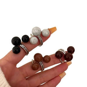 Three-layer open ring featuring polished colorful resin beads in black and white marble