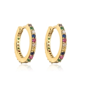 Macro detail of gold hoop earrings featuring multi-color micro-pave gemstone inlay