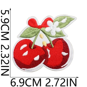Detailed view of cherry embroidery patch with white flower and red bow, size 6.9x5.9cm
