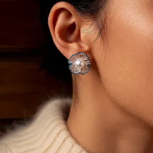 Elegant hollow floral pearl stud earrings with blue enamel outline for women