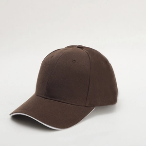 Detail view of coffee brown baseball cap featuring stylish white piping and stitched seams