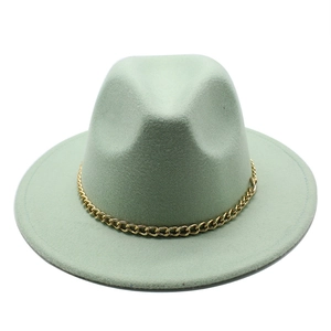 Detail of mint green wool fedora hat featuring a stylish chunky gold chain decoration