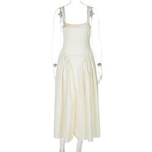 Back view of beige plaid dress featuring hidden zipper and pleated waist detail