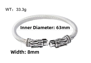 Macro view of vintage viking wolf head bangle with twisted rope design and dimensions