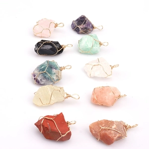 Selection of ten natural raw crystal pendants with gold wire wrapping detail