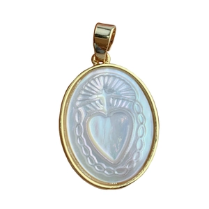 Oval gold necklace pendant with white mother of pearl and sacred heart cross engraving
