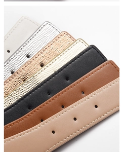 Multiple stylish PU leather waist belts in beige, snakeskin, black and brown textures