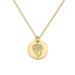 Detailed macro view of gold-plated circular pendant with delicate flower engraving on chain