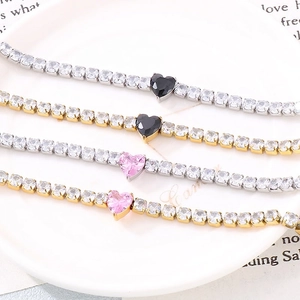 Sparkling titanium steel tennis bracelet with heart-shaped stone in gold and silver finish