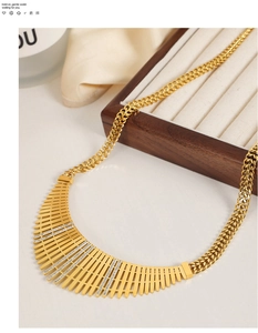Detailed macro view of gold-plated fence necklace with sparkling zircon stone rows