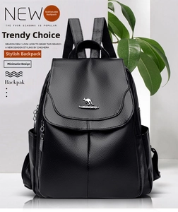 Detail of elegant black faux leather backpack featuring a silver kangaroo emblem logo