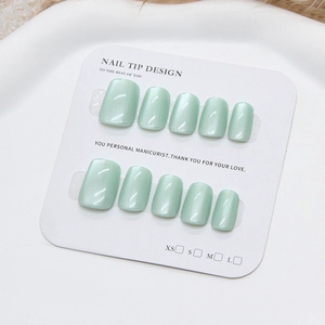 Short square mint green cat eye press-on nails set with subtle shimmering pearlescent finish