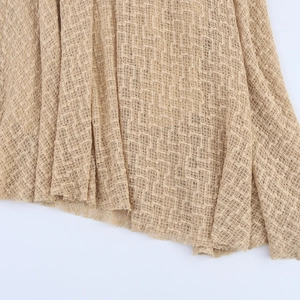 Beige round neck sleeveless knitted dress with jacquard texture and relaxed fit