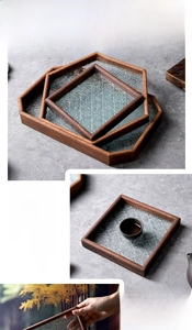 Detailed view of vintage begonia glass and dark wood tray for tea sets and snacks