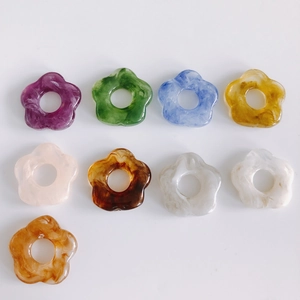 Close-up of colorful 26mm marble pattern resin flower charms for DIY jewelry making