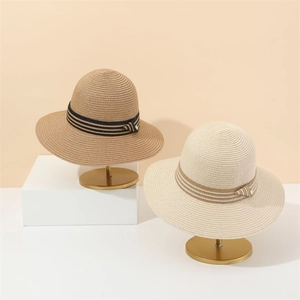 Elegant wide brim French straw hats in brown and beige with stylish decorative ribbons
