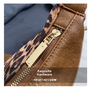 Detailed macro view of high-quality gold zipper on leopard print shoulder bag fabric