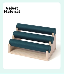 Detailed view of the 3-tier bamboo base and dark green velvet material for bracelet display