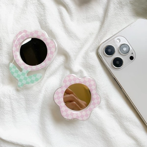 Detailed view of checkered tulip and floral phone socket grips with small mirrors