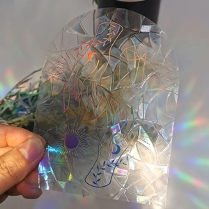 Rainbow suncatcher window film with geometric mosaic patterns and mystical hand artwork