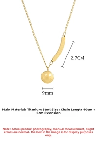 Detail of gold smile pendant and bar necklace showing dimensions 40cm and 5cm extender