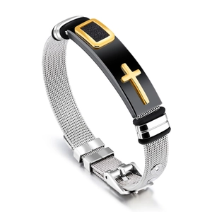 Detail view of adjustable silver mesh bracelet with golden cross on black metal plate