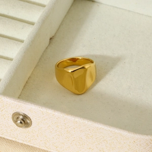 18K gold plated 316L stainless steel ring with hammered texture in a beige jewelry box