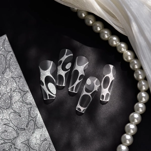 Sparkly silver glitter line stickers on semi-transparent matte press-on nails with pearls
