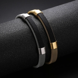 Detail of woven stainless steel mesh bracelets with gold and silver finishes and rubber accents