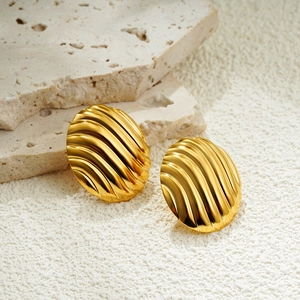 Elegant 18K gold plated oval stud earrings with textured ripple design on natural stone