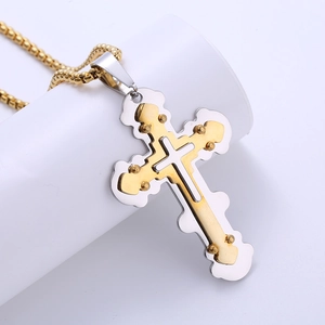 Men's retro stainless steel two-tone gold and silver cross pendant necklace on white stand