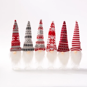 Detailed view of six Christmas gnome wine bottle covers with knitted hats and white beards