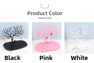 Detailed view of antler-shaped jewelry organizers in black, pink, and white finishes